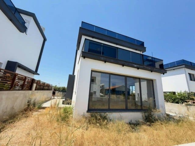 Glass-railed balconies and wide sliding glass doors