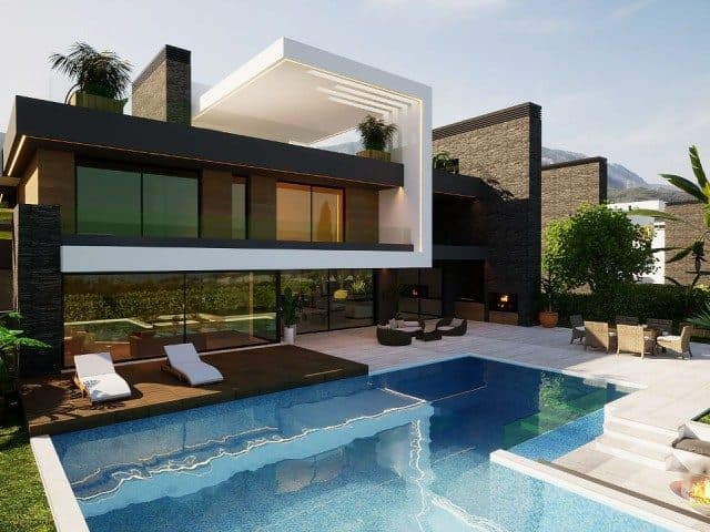 The glass-fronted house overlooks a pool and wooden sun deck