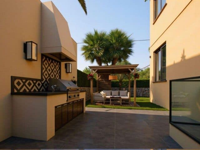 Taş döşeli avluda barbekü tezgâhı ve pergola altında oturma alanı