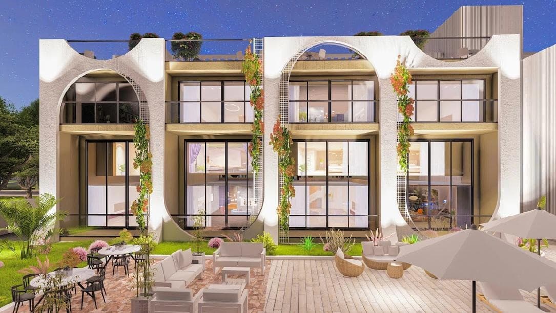 Modern tasarımlı apartman binasının dış cephesi ve peyzajlı bahçe alanı.