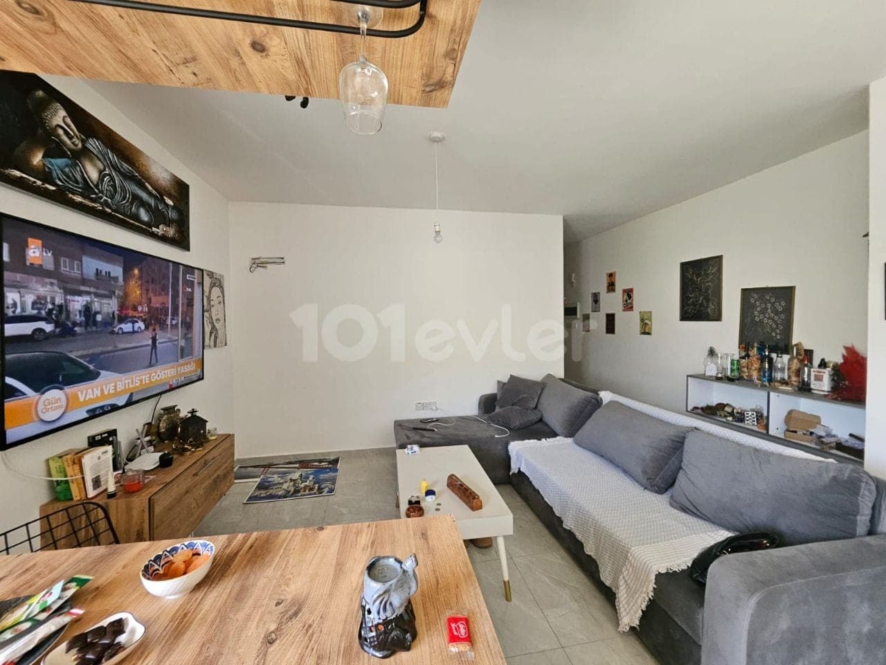 Spacious living room with dining area and TV unit
