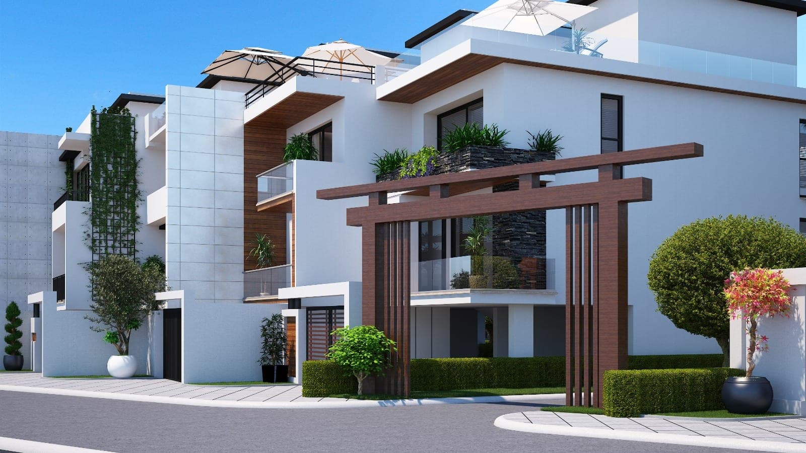 Exterior of a modern villa with garden and balconies.