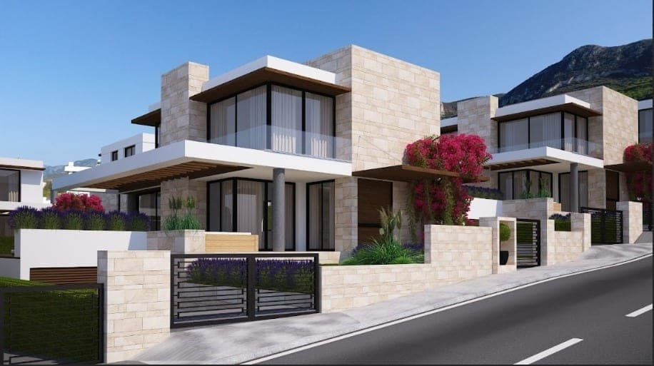 Modern villa with stone cladding, iron gate parking, and mountain view.