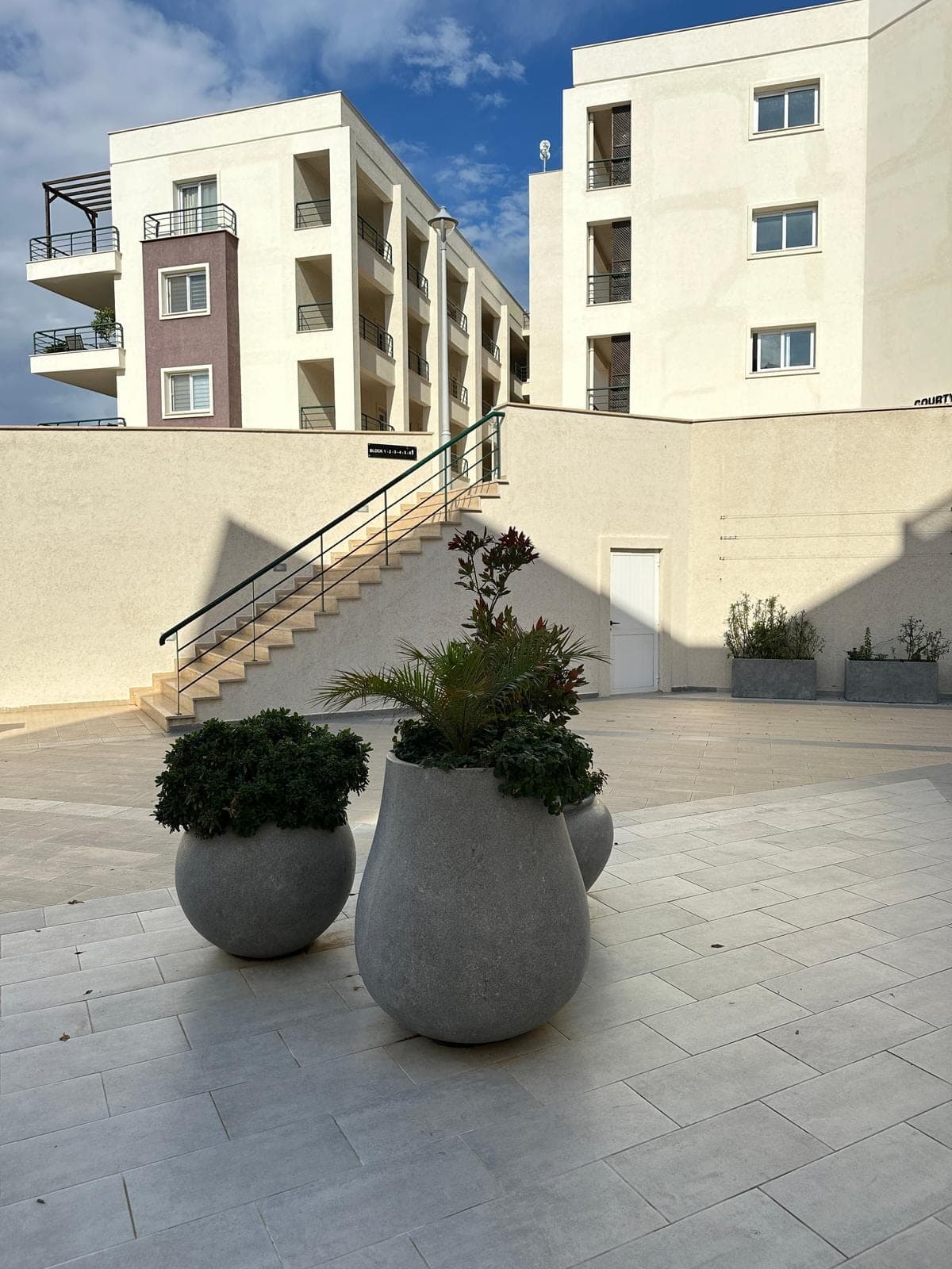 Modern apartment buildings and outdoor area with stairs
