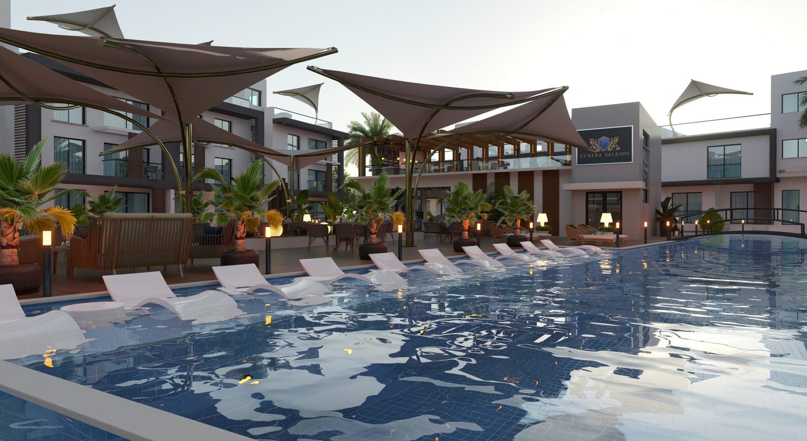 Spacious swimming pool area with sun loungers and umbrellas, surrounded by facilities.