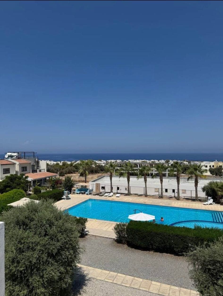 Shared swimming pool and surroundings with sea view