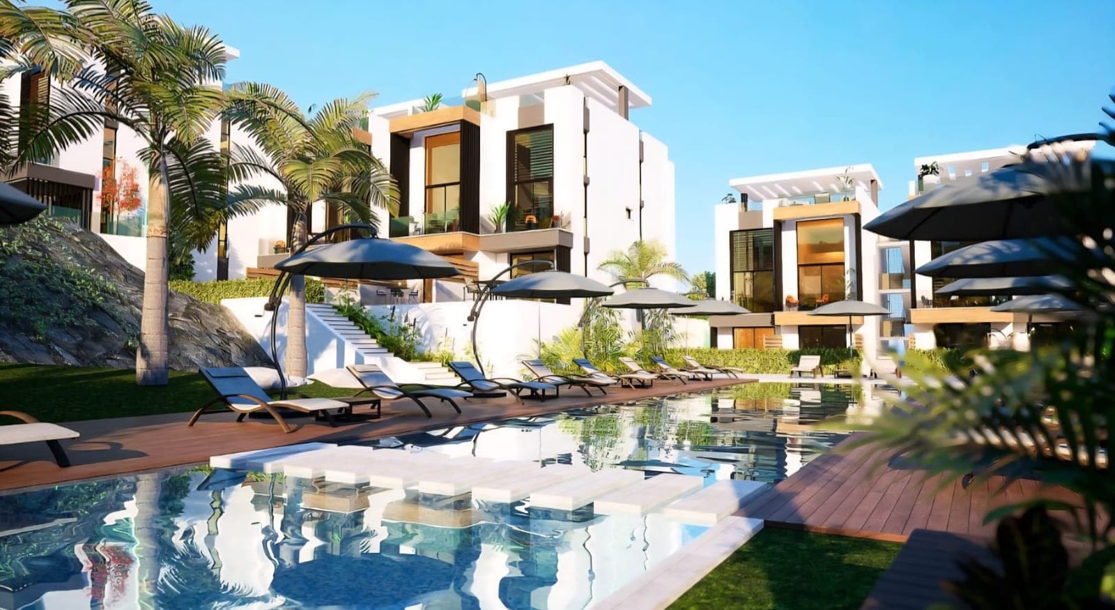 Exterior view of a modern complex with pool and palm trees.