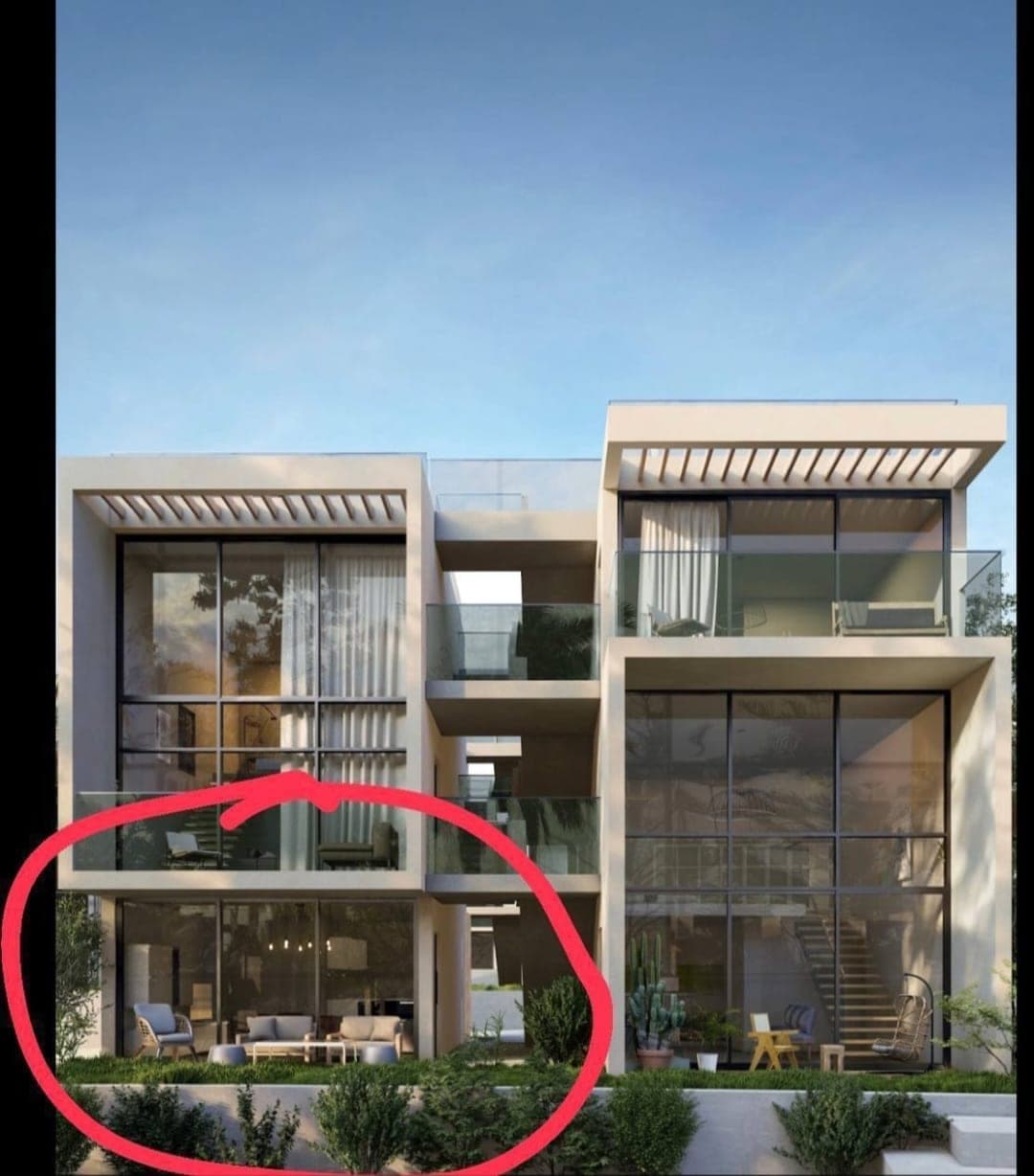 Exterior view of a multi-story residential building with modern architecture and large windows.