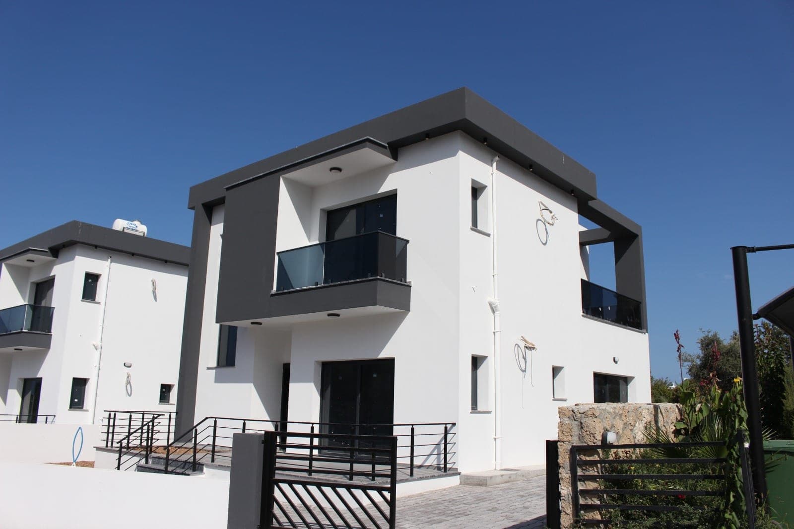 Exterior of a modern white and grey villa