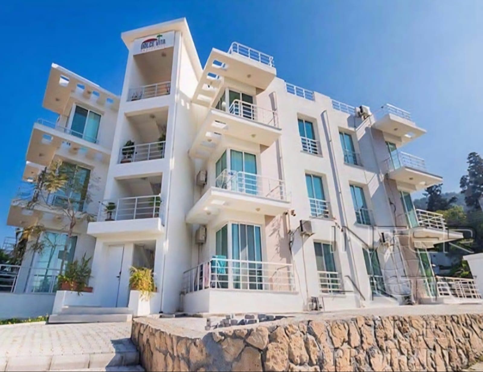 Exterior of a multi-story apartment building with modern architecture