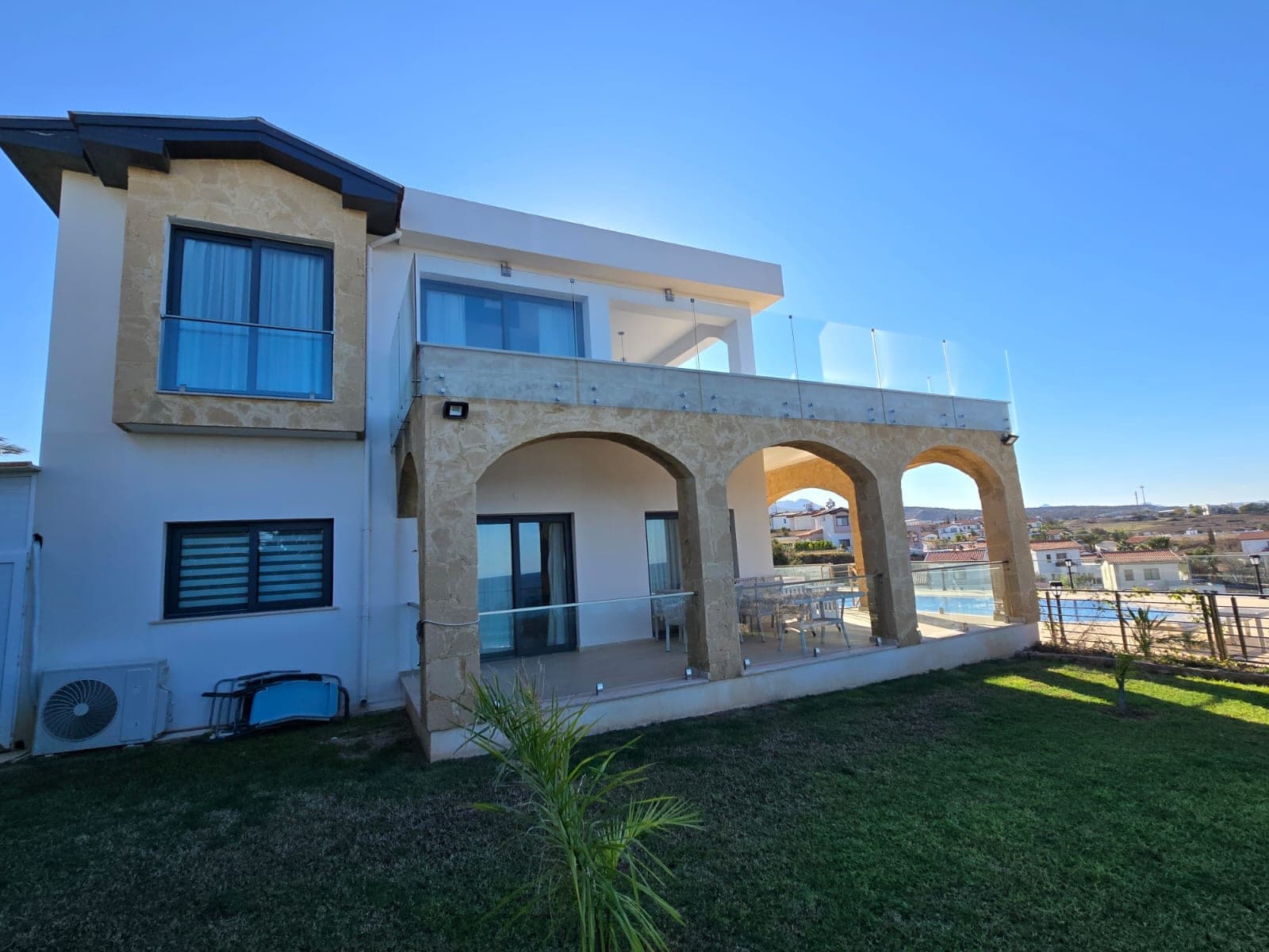 White and stone clad villa with private pool and sea view balcony