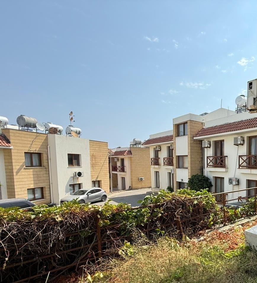 Exterior of buildings and parking area in front