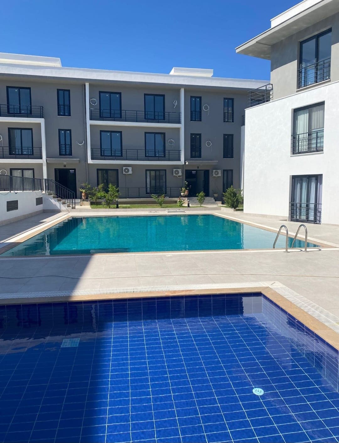 Shared swimming pool between apartment buildings