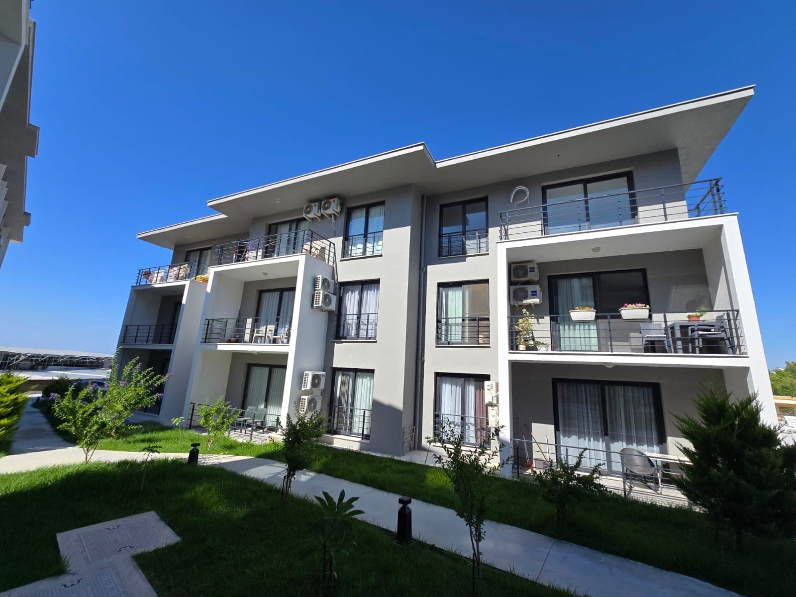 Front facade and balconies of a modern designed apartment building