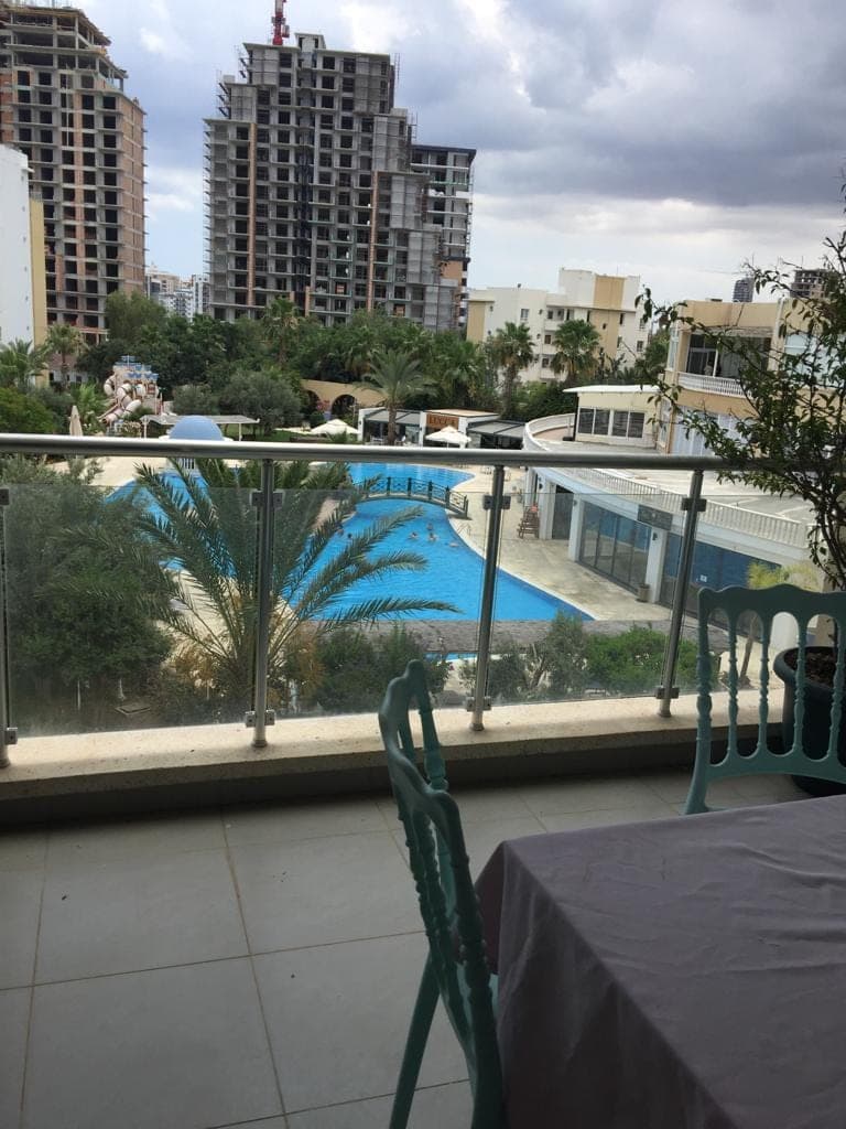 General view of the pool and surrounding buildings from the balcony
