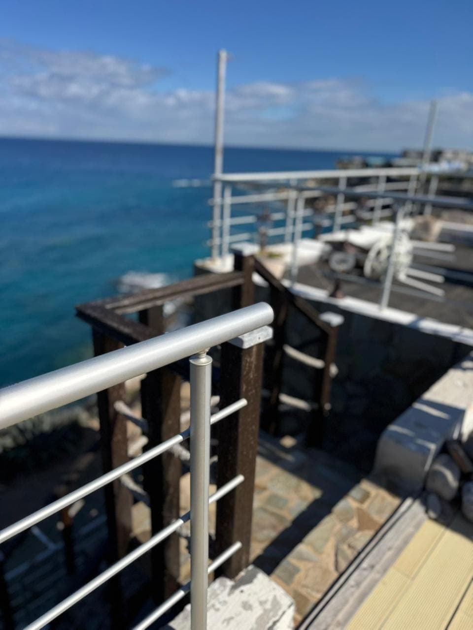 Terrace or balcony railing with sea view.