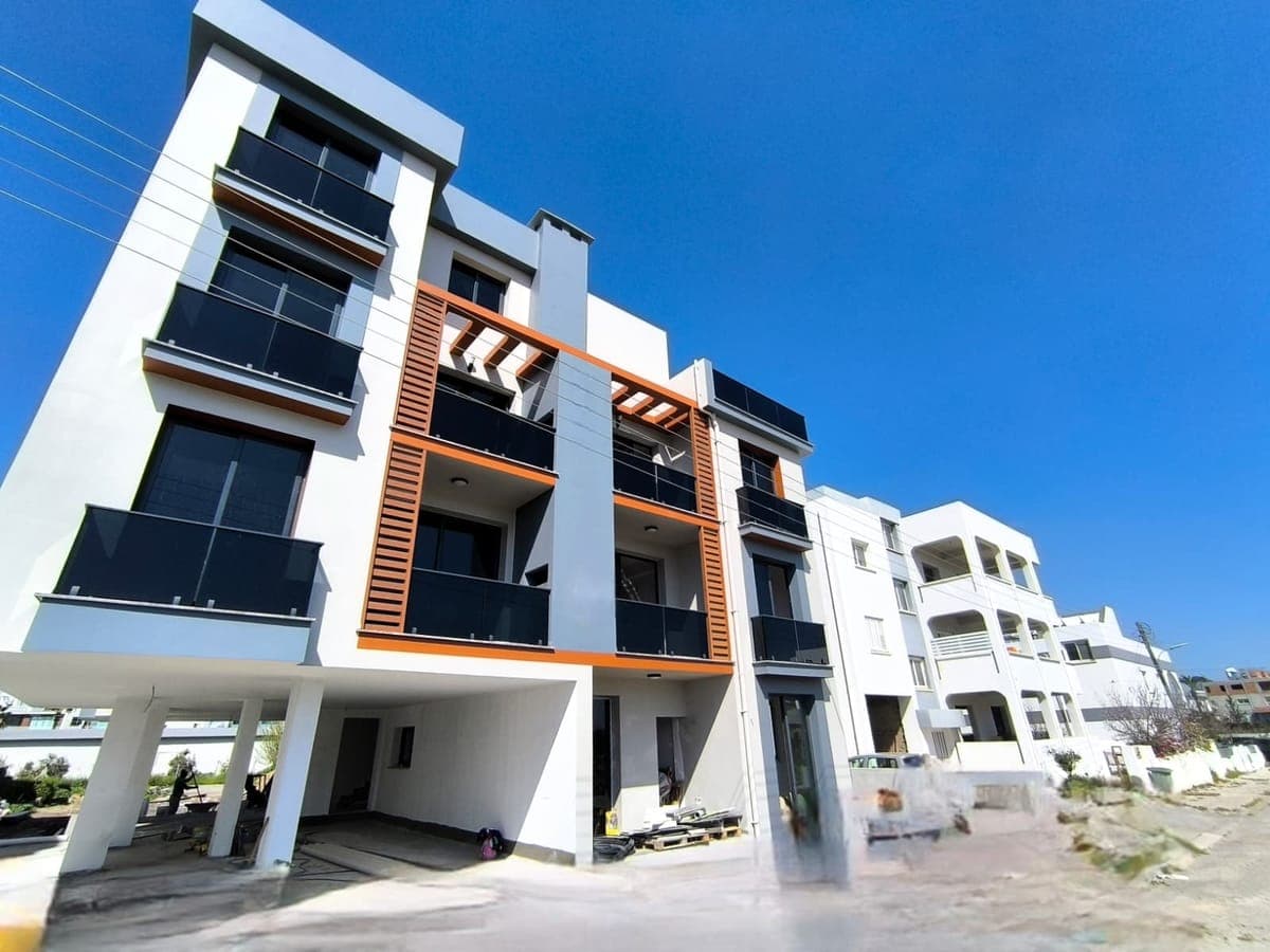 Exterior view of a modern apartment building with balconies.