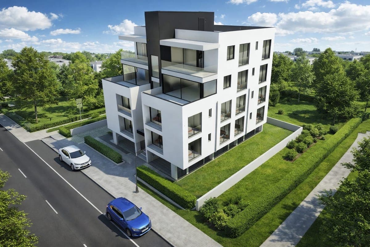 Modern designed apartment building with green area and parking.