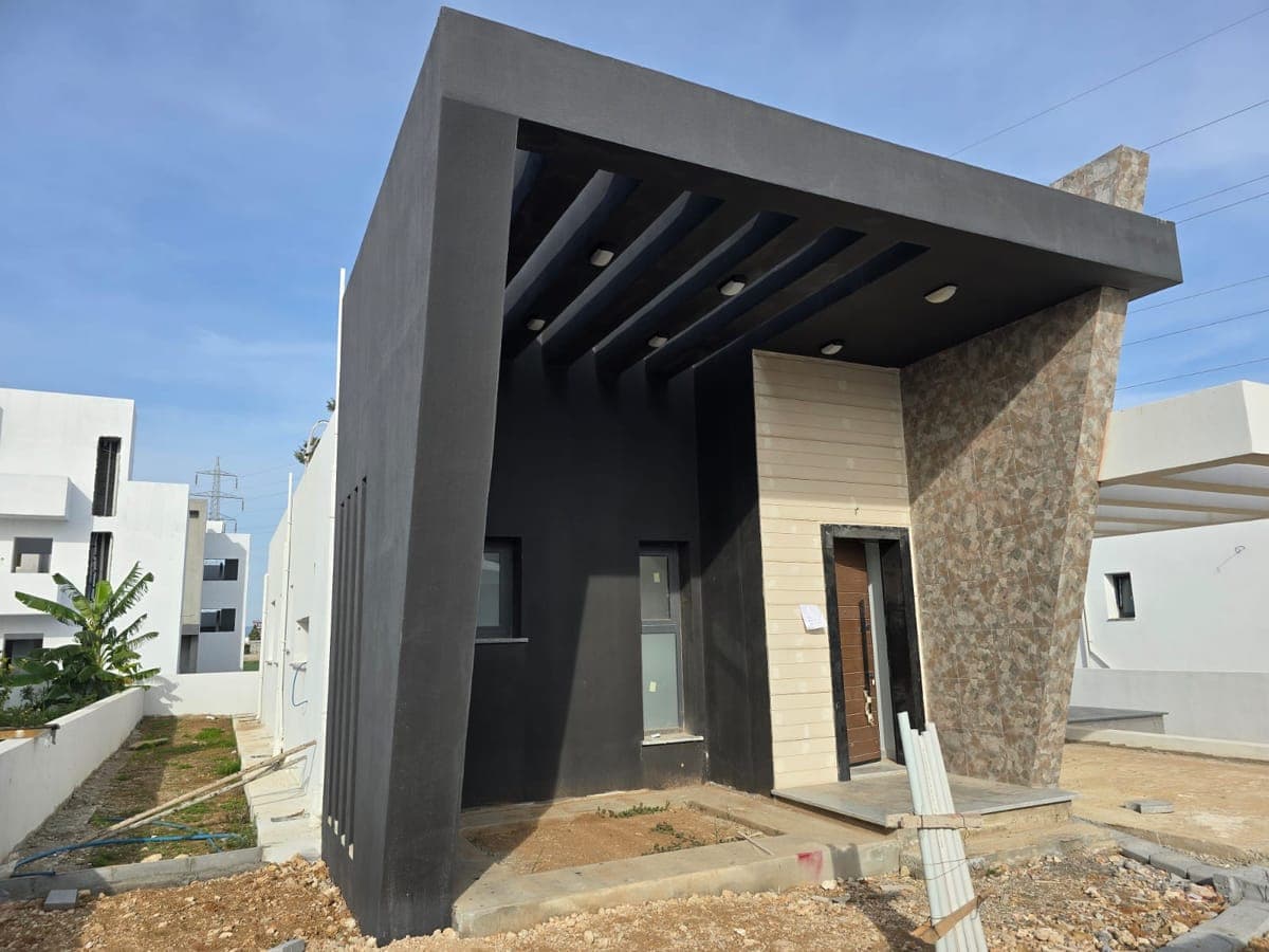 Exterior and entrance of a modern-designed detached property.
