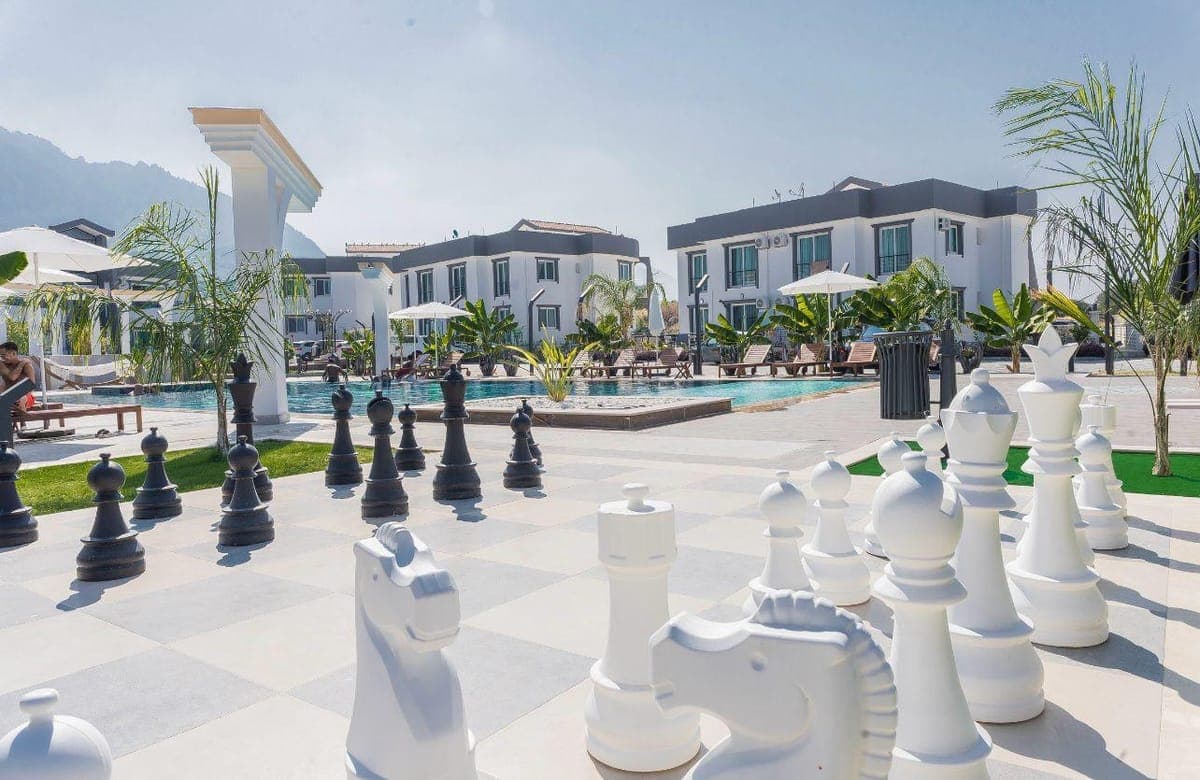 Spacious pool area and exterior of modern buildings.